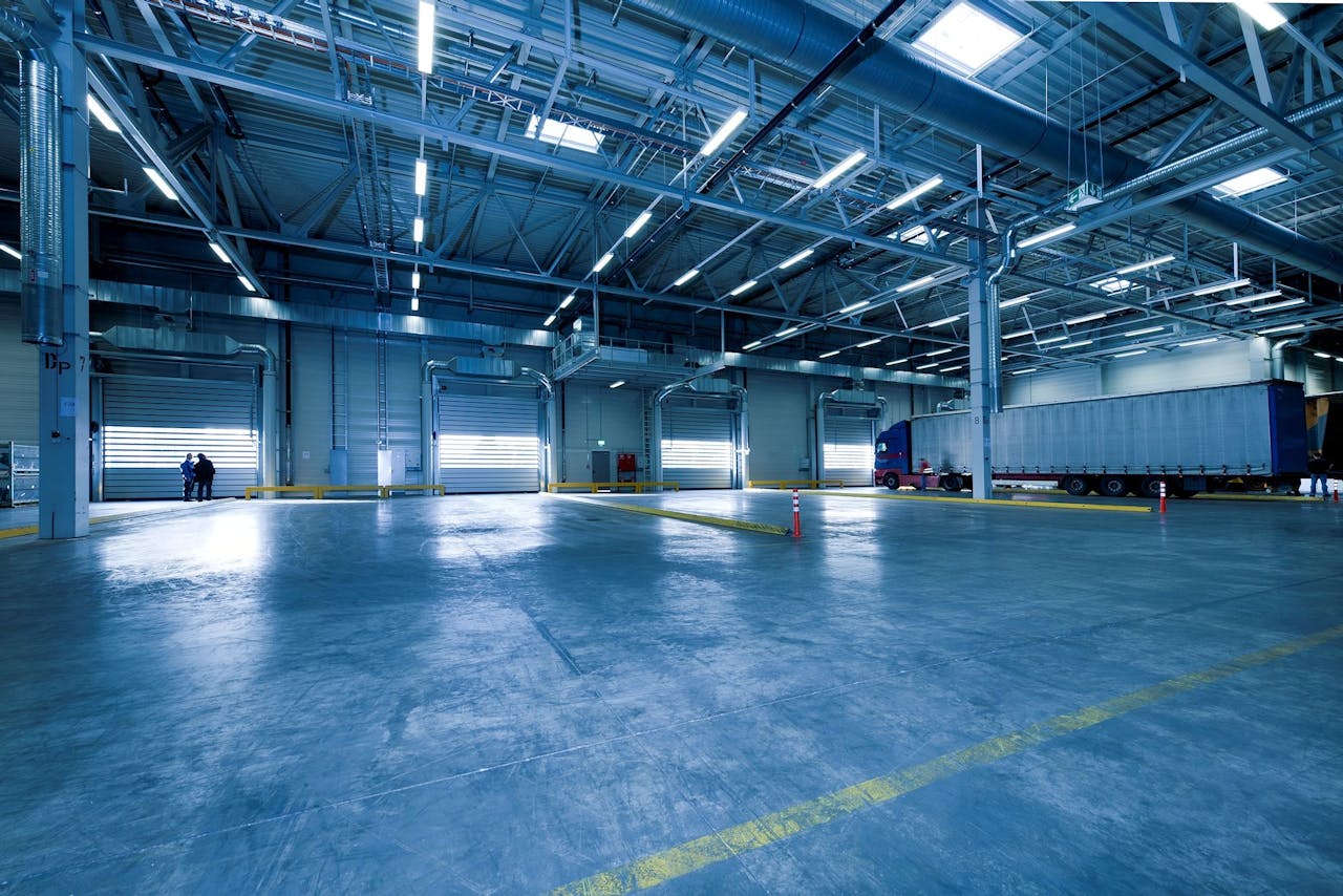 The Art of Drawing Readers In: Your attractive post title goes here Large warehouse interior with docked truck, ideal for logistics and warehousing.